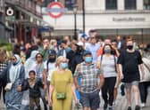 People wearing face masks among crowds of pedestrians in Covent Garden, London. Prime Minister Boris Johnson is expected to scrap social distancing and mask-wearing requirements on England's so-called "Freedom Day" of July 19. Photo: Dominic Lipinski/PA Wire