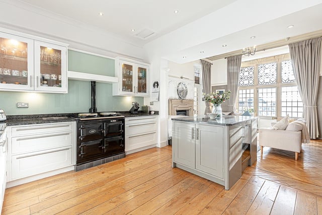 The bespoke Kenneth Anderson kitchen was handmade, and features a gas-fired AGA range cooker plus a wood-burning stove, which adds a cosy layer of warmth to what the owners describe as being the main family hub.