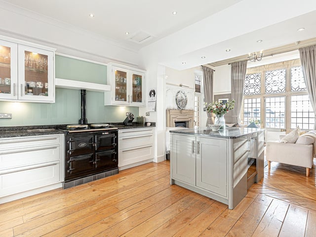 The bespoke Kenneth Anderson kitchen was handmade, and features a gas-fired AGA range cooker plus a wood-burning stove, which adds a cosy layer of warmth to what the owners describe as being the main family hub.