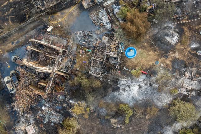 The charred remains of homes in the village of Wennington, July 20 2022. The heatwave blaze which has destroyed homes in an east London village has been described as a "worst nightmare" event. (Tom Maddick / SWNS)