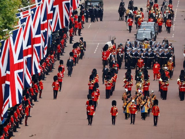 LONDON, ENGLAND - SEPTEMBER 19: The Queen's funeral cortege borne on the State Gun Carriage of the Royal Navy travels along The Mall on September 19, 2022 in London, England. Elizabeth Alexandra Mary Windsor was born in Bruton Street, Mayfair, London on 21 April 1926. She married Prince Philip in 1947 and ascended the throne of the United Kingdom and Commonwealth on 6 February 1952 after the death of her Father, King George VI. Queen Elizabeth II died at Balmoral Castle in Scotland on September 8, 2022, and is succeeded by her eldest son, King Charles III. (Photo by Chip Somodevilla/Getty Images)