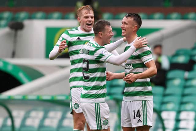 Stephen Welsh (far left) and Callum McGregor (centre) congratulate David Turnbull after the Celtic midfielder scored a hat-trick against St Mirren.