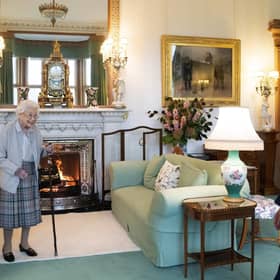 Queen Elizabeth II, left, smiles at Liz Truss during an audience at Balmoral, Scotland, where she invited the newly elected leader of the Conservative party to become Prime Minister and form a new government,