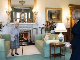 Queen Elizabeth II, left, smiles at Liz Truss during an audience at Balmoral, Scotland, where she invited the newly elected leader of the Conservative party to become Prime Minister and form a new government,