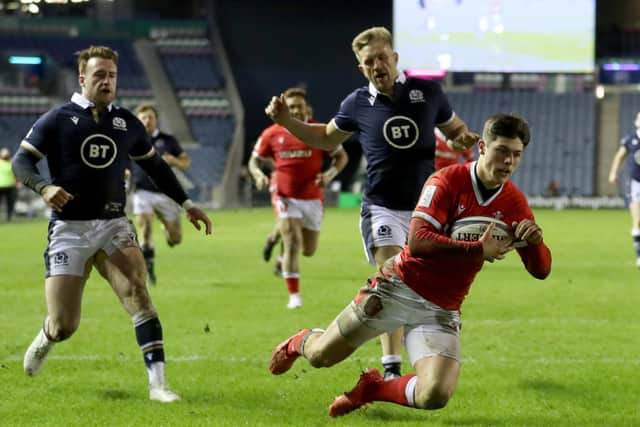 Wales' Louis Rees-Zammit dives over to score his side's fourth and decisive try at BT Murrayfield Stadium. Picture: Jane Barlow/PA