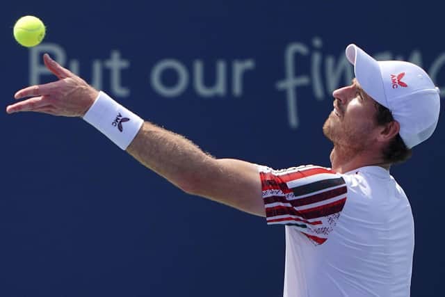Andy Murray, of Britain, serves to Hubert Hurkacz, of Poland, Wednesday, Aug. 18, 2021, during the Western & Southern Open tennis tournament at the Lindner Family Tennis Center in Mason, Ohio. (Kareem Elgazzar/The Cincinnati Enquirer via AP)