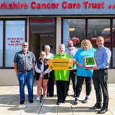 Asda Coatbridge Community Champion Ann Binks and GSM Kevin McPhee surprised Lanarkshire Cancer Care Trust with a 'Golden Ticket' for £1,500 worth of free fuel