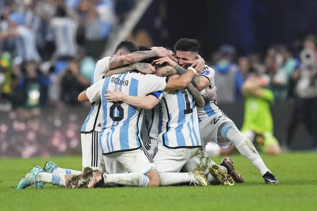 Argentina players celebrate winning the World Cup final against France.