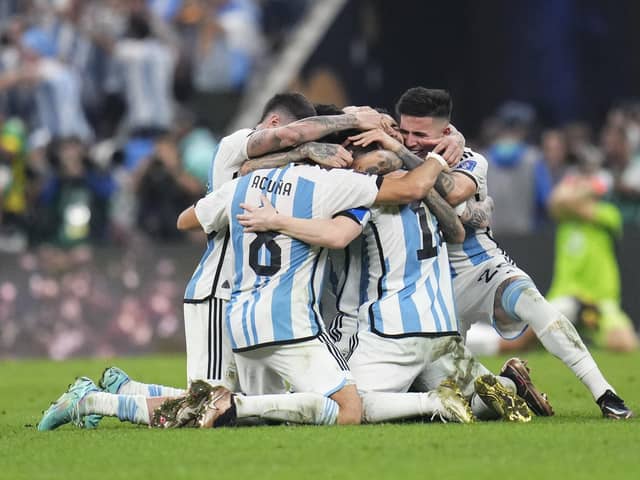 Argentina players celebrate winning the World Cup final against France.