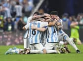 Argentina players celebrate winning the World Cup final against France.