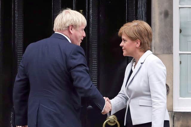 Nicola Sturgeon and Boris Johnson have fundamental disagreements but they should co-operate to help make the Cop26 climate summit a success (Picture: Jane Barlow/PA Wire)