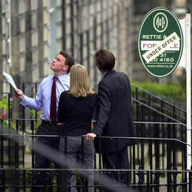 Estate agent showing a property (picture taken before current restrictions).