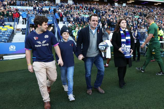 Tom Smith delivers the match ball ahead of the game against South Africa last November, accompanied by his children Amelie, Angus and Teddy.  (Photo by Craig Williamson / SNS Group)