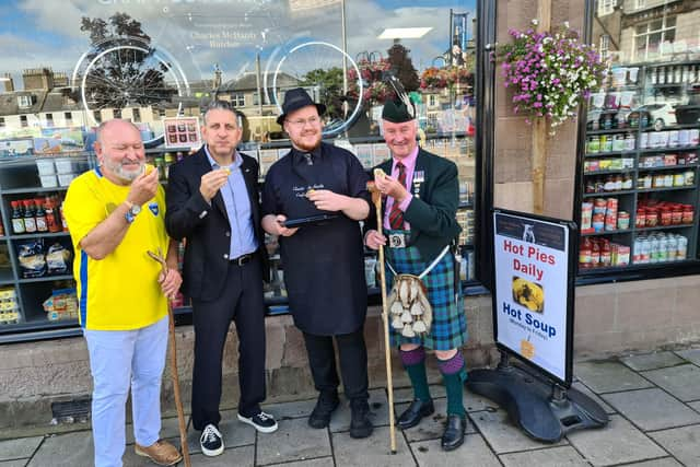 Enjoying a haggis slice at McHardy's butcher.