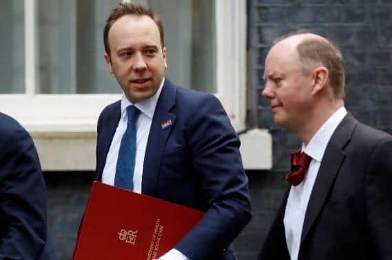 Former UK Health Secretary Matt Hancock enters Downing Street alongside Chief Medical Officer for England Professor Chris Whitty (right)
