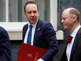 Former UK Health Secretary Matt Hancock enters Downing Street alongside Chief Medical Officer for England Professor Chris Whitty (right)