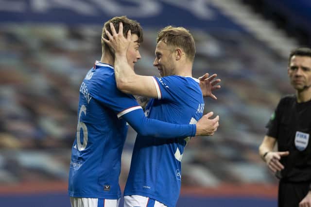 Rangers' Nathan Patterson (L) celebrates making it 4-0 with Scott Arfield during a Scottish Cup Third Round tie between Rangers and Cove Rangers at Ibrox Stadium, on April 04, 2021, in Glasgow, Scotland. (Photo by Alan Harvey / SNS Group)