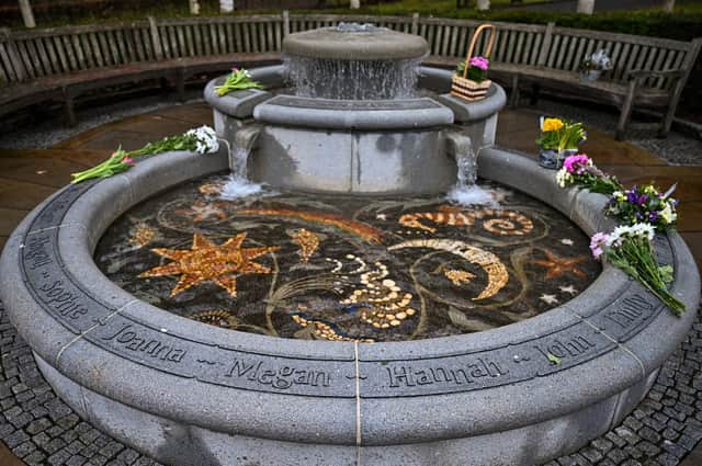 Flowers left last year in Dunblane's Garden of Remembrance for the teacher and 16 children killed in the 1996 school shooting (Picture: Jeff J Mitchell/Getty Images)