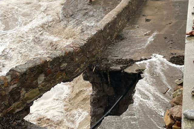 Rob Allen took this shot of the huge hole he fell into when the sea wall and shared walkway at the rear of his home, one of the historical Gyles Houses, collapsed