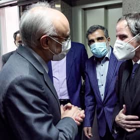 The head of the Atomic Energy Organisation of Iran, Ali Akbar Salehi, left, meets the visiting Director General of the International Atomic Energy Agency Rafael Grossi in Tehran in February (Picture: AFPTV/pool/AFP via Getty Images)