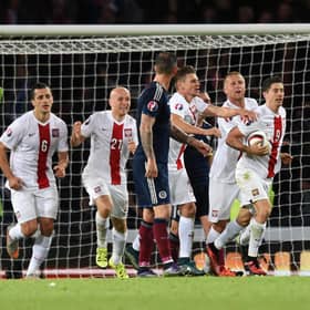Poland's Robert Lewandowski (second from right) celebrates his goal late on against Scotland back in 2015
