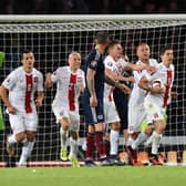 Poland's Robert Lewandowski (second from right) celebrates his goal late on against Scotland back in 2015