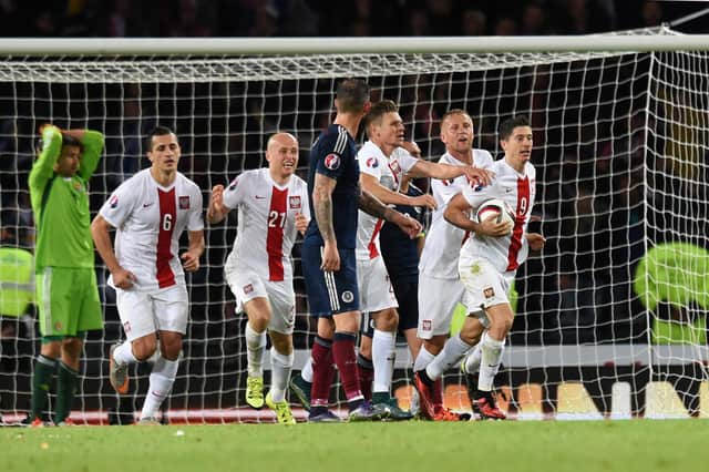 Poland's Robert Lewandowski (second from right) celebrates his goal late on against Scotland back in 2015