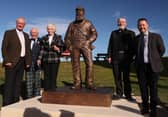 The main platform party stand beside the sculpture for the unveiling of the memorial sculpture of four-time Open champion Old Tom Morris were, from left, Sandy Lyle, project chairman Ronald Sandford, Sheila Walker Old Tom's great, great granddaughter, sculptor David Annand and local golf historian Roger McStravick. Picture: Warren Little/Getty Images.