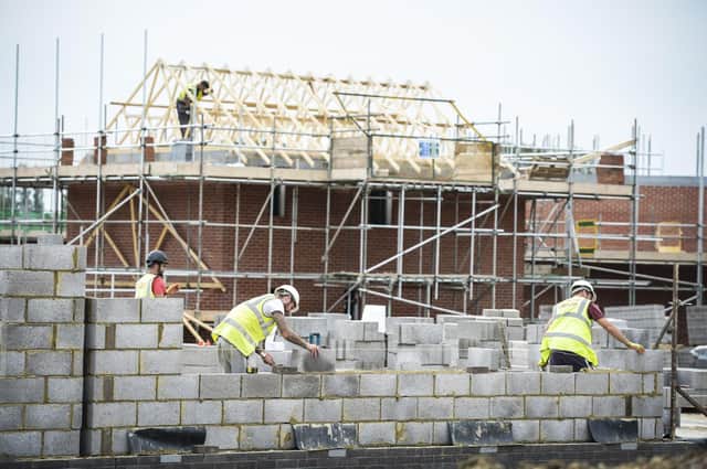 File photo dated 25/08/16 of builders on a building site, as the number of new semi-detached homes being registered during 2016 reached its highest levels in at least 30 years, according to housebuilding industry figures. PRESS ASSOCIATION Photo. Issue date: Friday February 3, 2017. Registrations of new-build detached homes across the UK also reached their highest levels since 2004 last year, according to the National House Building Council (NHBC), which said the sector has "remained resilient" despite the caution surrounding Brexit. See PA story MONEY Housebuilding. Photo credit should read: Ben Birchall/PA Wire 