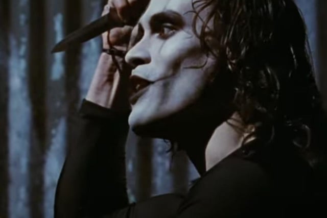 The late, great Brandon Lee stars as The Crow, a cult superhero who comes back from the dead a man to avenge the murder of him and his fiance. Cr: YouTube/Miramax