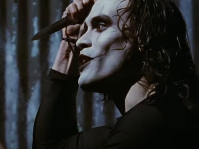 The late, great Brandon Lee stars as The Crow, a cult superhero who comes back from the dead a man to avenge the murder of him and his fiance. Cr: YouTube/Miramax