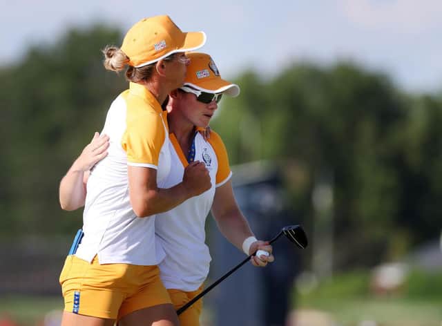 Mel Reid and Leona Maguire celebrate securing a half point in the penultimate session in the 17th Solheim Cup in Toledo, Ohio. Picture: Gregory Shamus/Getty Images.