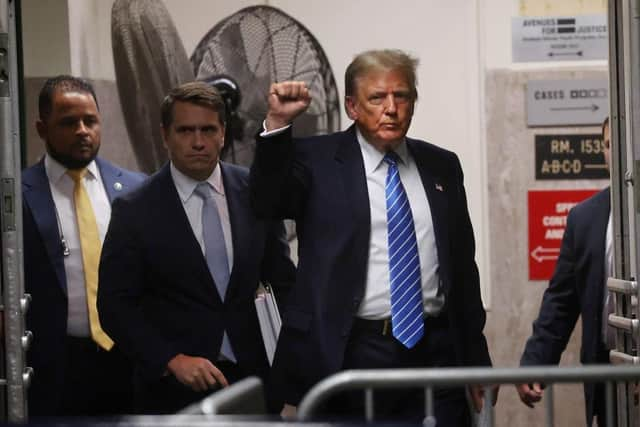 Former US president Donald Trump and attorney Todd Blanche return from a break during his trial. Picture: Getty Images