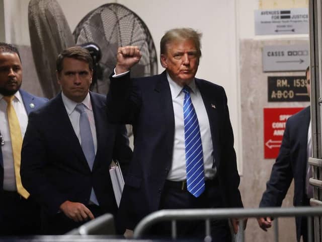 Former US president Donald Trump and attorney Todd Blanche return from a break during his trial. Picture: Getty Images