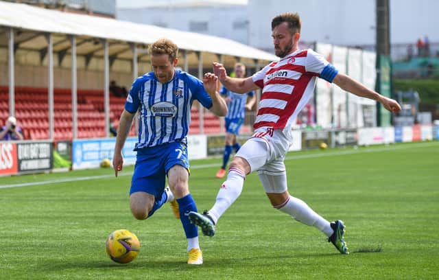 Kilmarnock's Rory McKenzie (left) is closed down by Hamilton's Scott McMann during the Rugby Park's last day victory - a result that could not spare them the play-offs but send them into the ties against Dundee in decent form. (Photo by Craig Foy / SNS Group)