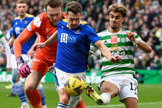 Celtic's Jota (right) competes with Craig Bryson during the cinch Premiership match between Celtic and St Johnstone. (Photo by Rob Casey / SNS Group)