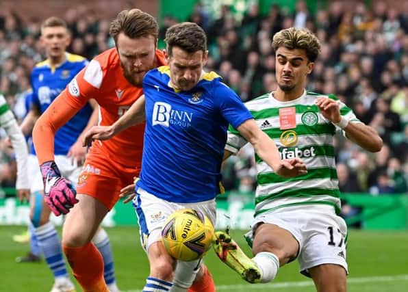 Celtic's Jota (right) competes with Craig Bryson during the cinch Premiership match between Celtic and St Johnstone. (Photo by Rob Casey / SNS Group)