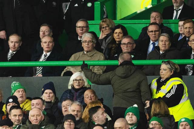 Celtic fans exchange words with members in the directors box including CEO Michael Nicholson.