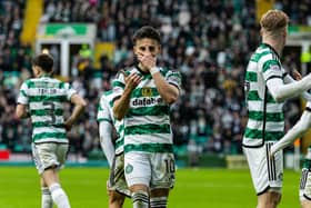 Nicolas Kuhn was on the scoresheet as Celtic defeated St Johnstone 3-1 to go top of the Premiership.