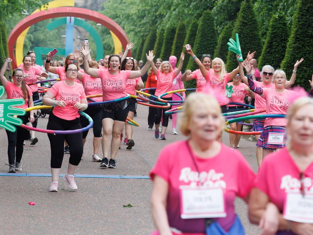 Competitors add another level to the race by adding their hula hoops. PIC: Steve Welsh.