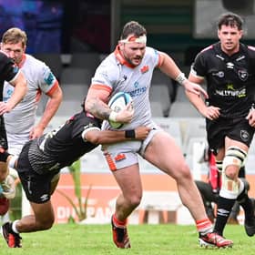 The Sharks pounce on Edinburgh's Ewan Ashman as he tries to break.