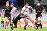 The Sharks pounce on Edinburgh's Ewan Ashman as he tries to break.