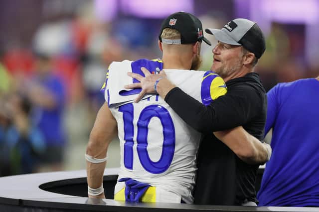 Cooper Kupp of the Los Angeles Rams celebrates with general manager Les Snead after Super Bowl LVI.