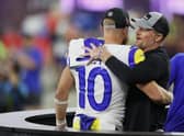 Cooper Kupp of the Los Angeles Rams celebrates with general manager Les Snead after Super Bowl LVI.