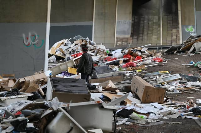 Mounds of illegally dumped rubbish pictured in August piled beneath the M8 in Riddrie, Glasgow (Picture: John Devlin)