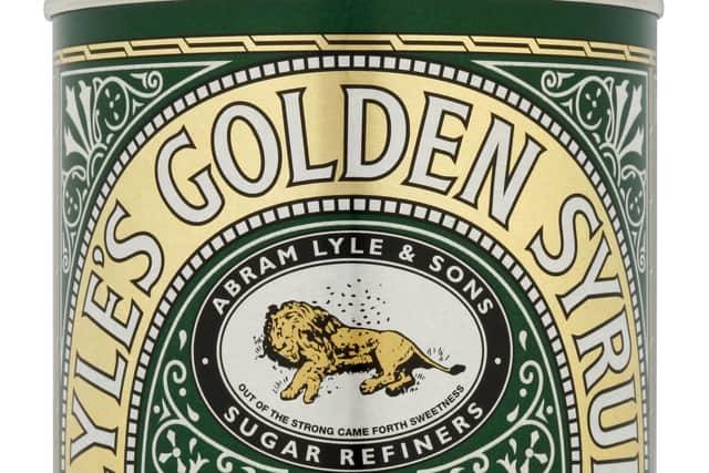 The green tin and golden lion packaging of Lyle's Golden Syrup which was first launched in 1881 and holds the Guinness World Record for the world’s oldest unchanged brand packaging. It has now had its first re-brand since 1883. Lyle's Golden Syrup/PA Wire