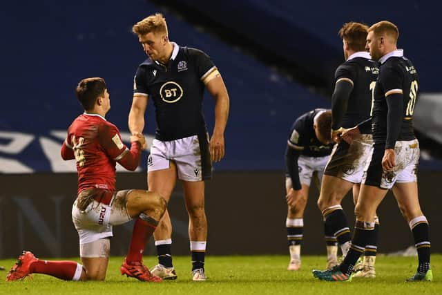 Chris Harris shakes hands with his Gloucester team-mate Louis Rees-Zammit after Scotland's defeat by Wales. Picture: Stu Forster/Getty Images