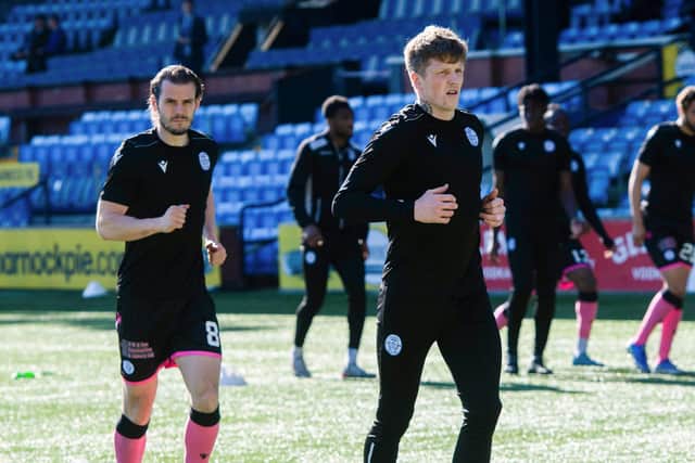 QoS player/manager Wullie Gibson (R) leads the warm-up during a cinch Championship match between Kilmarnock and Queen of the South at Rugby Park, on March 19, 2022, in Kilmarnock, Scotland. (Photo by Sammy Turner / SNS Group)