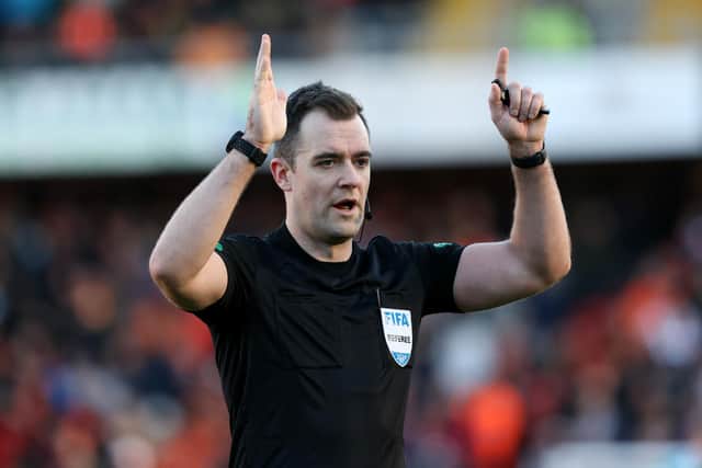 Referee Don Robertson.