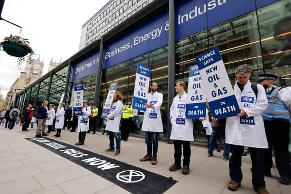 Activists from the climate change protest group Extinction Rebellion demonstrate outside of the Department for Business, Energy and Industrial Strategy in London (Picture: Tolga Akmen/AFP via Getty Images)